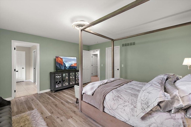 966 Wynstone Cir N, Oakland, MI 48363 - bedroom featuring light wood-style flooring and baseboards