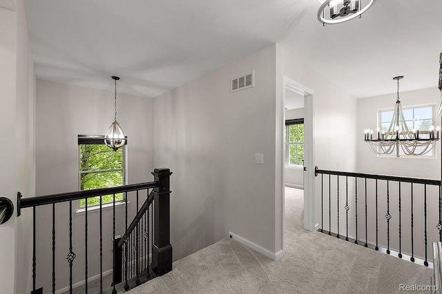 966 Wynstone Cir N, Oakland, MI 48363 - corridor featuring a chandelier, an upstairs landing, and carpet