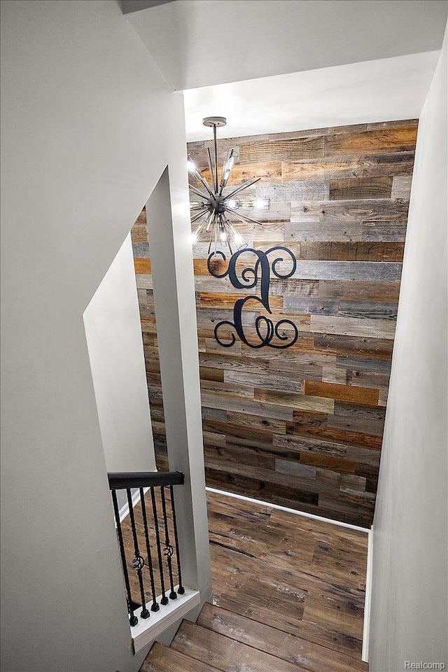 966 Wynstone Cir N, Oakland, MI 48363 - detailed view of a chandelier, wood walls, and wood finished floors