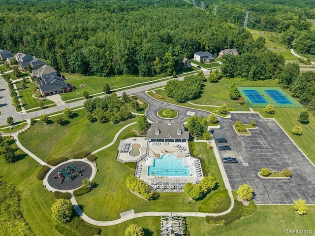966 Wynstone Cir N, Oakland, MI 48363 - aerial view of a pool area and a heavily wooded area