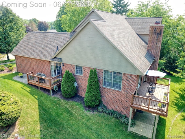 1070 Pointe Place Ct, Rochester, MI 48307 - back of house with a deck, a lawn, brick siding, and a chimney
