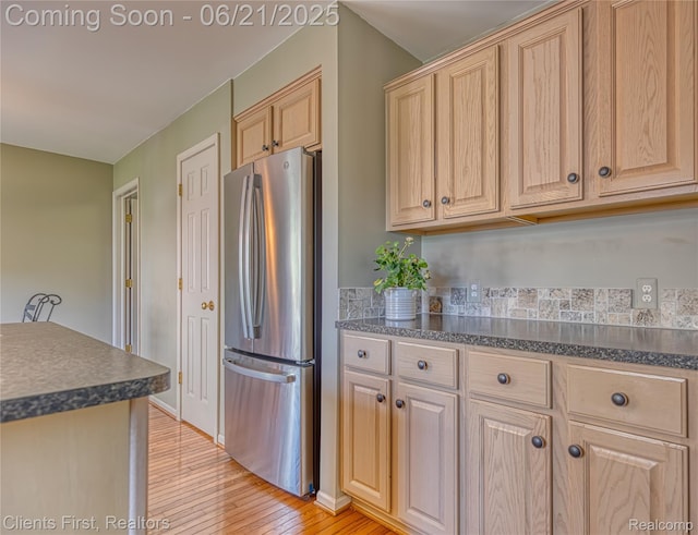 1070 Pointe Place Ct, Rochester, MI 48307 - kitchen with freestanding refrigerator, dark countertops, light wood-style flooring, and light brown cabinets