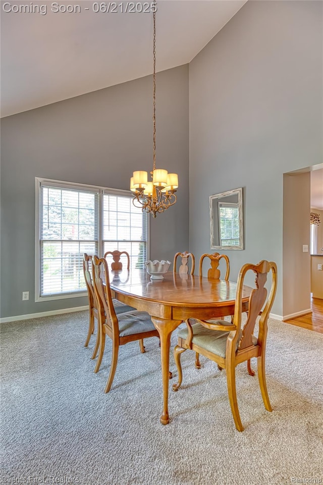 1070 Pointe Place Ct, Rochester, MI 48307 - carpeted dining room with high vaulted ceiling, a chandelier, and plenty of natural light