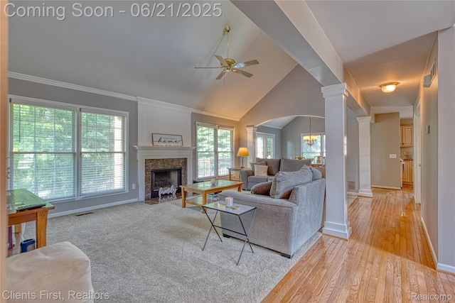 1070 Pointe Place Ct, Rochester, MI 48307 - living room with ornate columns, a ceiling fan, a high end fireplace, light wood-style floors, and lofted ceiling