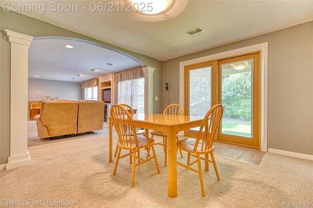 1070 Pointe Place Ct, Rochester, MI 48307 - dining space featuring ornate columns, arched walkways, light colored carpet, and recessed lighting