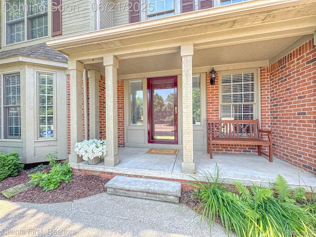 1070 Pointe Place Ct, Rochester, MI 48307 - entrance to property with a porch and brick siding
