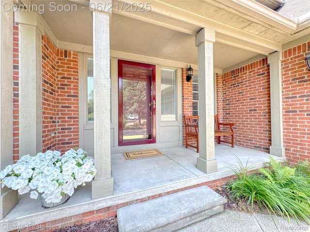1070 Pointe Place Ct, Rochester, MI 48307 - property entrance with covered porch and brick siding