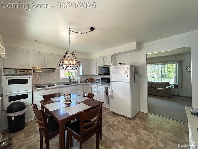 30821 Longfellow Ave, Madison Heights, MI 48071 - dining space with plenty of natural light and a chandelier