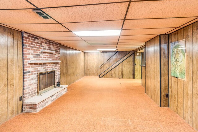 275 Pawnee St, Battle Creek, MI 49014 - finished below grade area featuring wooden walls, carpet flooring, a fireplace, and a paneled ceiling