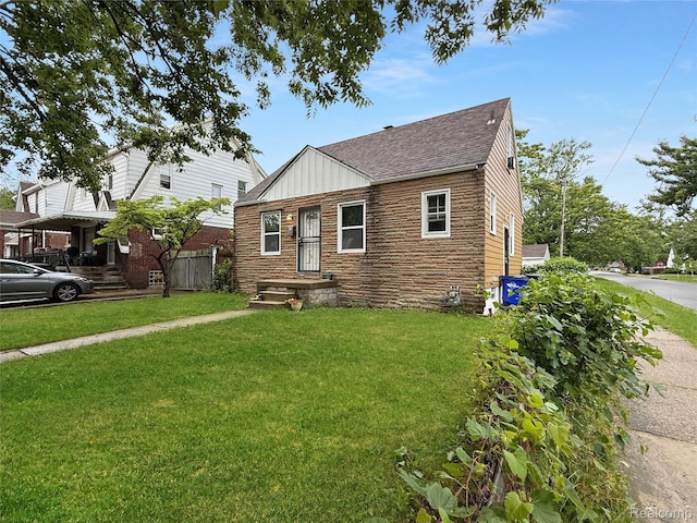 20115 Pelkey St, Detroit, MI 48205 - bungalow featuring roof with shingles and a front yard