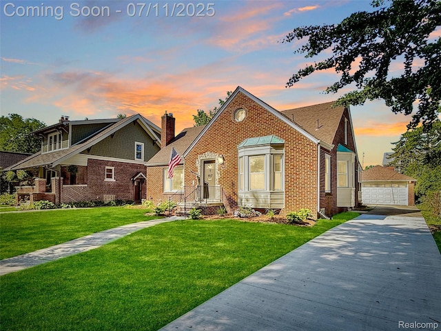 807 Barrington Rd, Grosse Pointe Park, MI 48230 - view of front facade with a chimney, brick siding, a front yard, and a detached garage