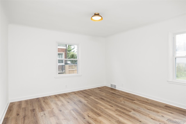 807 Barrington Rd, Grosse Pointe Park, MI 48230 - empty room with wood finished floors and baseboards