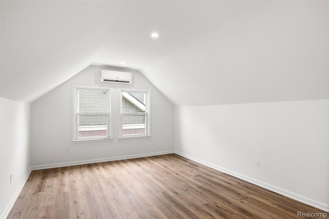 807 Barrington Rd, Grosse Pointe Park, MI 48230 - bonus room with an AC wall unit, wood finished floors, vaulted ceiling, and recessed lighting