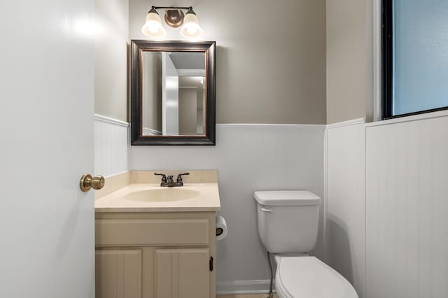 3745 Cedaridge Rd, Kalamazoo, MI 49008 - half bathroom with a wainscoted wall and vanity