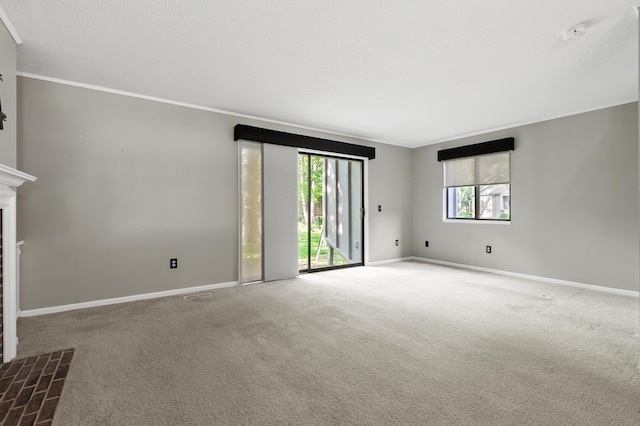 3745 Cedaridge Rd, Kalamazoo, MI 49008 - carpeted spare room featuring ornamental molding, a fireplace, and a smoke detector