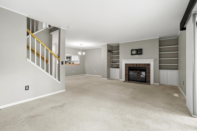 3745 Cedaridge Rd, Kalamazoo, MI 49008 - unfurnished living room with light carpet, stairway, a fireplace, a chandelier, and crown molding