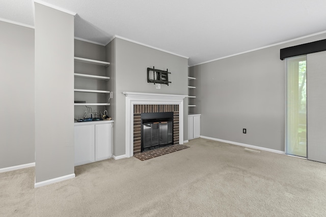 3745 Cedaridge Rd, Kalamazoo, MI 49008 - unfurnished living room featuring carpet flooring, a brick fireplace, built in shelves, and crown molding