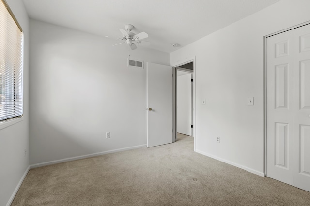 3745 Cedaridge Rd, Kalamazoo, MI 49008 - unfurnished bedroom with carpet floors, multiple windows, and a closet