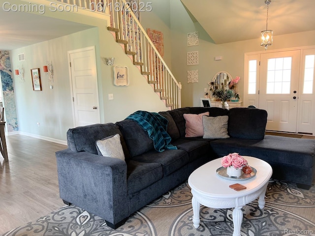 11236 Chyna Run, Davisburg, MI 48350 - living area featuring stairway, lofted ceiling, and light wood finished floors