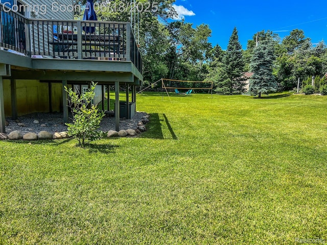 11236 Chyna Run, Davisburg, MI 48350 - view of grassy yard featuring a wooden deck and view of wooded area