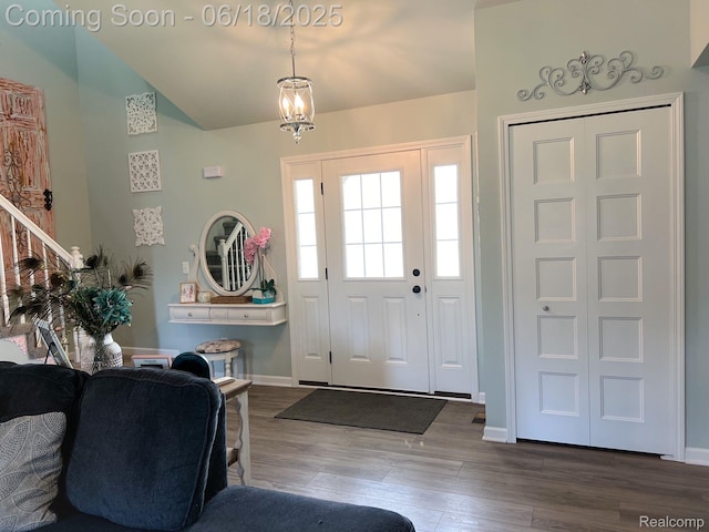 11236 Chyna Run, Davisburg, MI 48350 - entryway with dark wood finished floors, lofted ceiling, and stairway