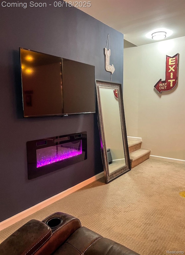 11236 Chyna Run, Davisburg, MI 48350 - home theater room featuring carpet floors and a glass covered fireplace