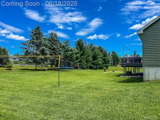 11236 Chyna Run, Davisburg, MI 48350 - view of grassy yard featuring a trampoline