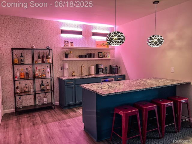 11236 Chyna Run, Davisburg, MI 48350 - indoor wet bar with dark wood-type flooring and pendant lighting