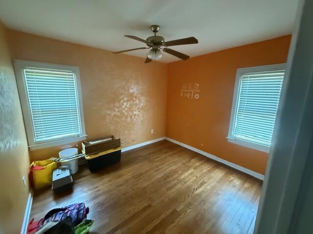 6185 Wing Ave SE, Grand Rapids, MI 49512 - empty room featuring a ceiling fan and wood finished floors