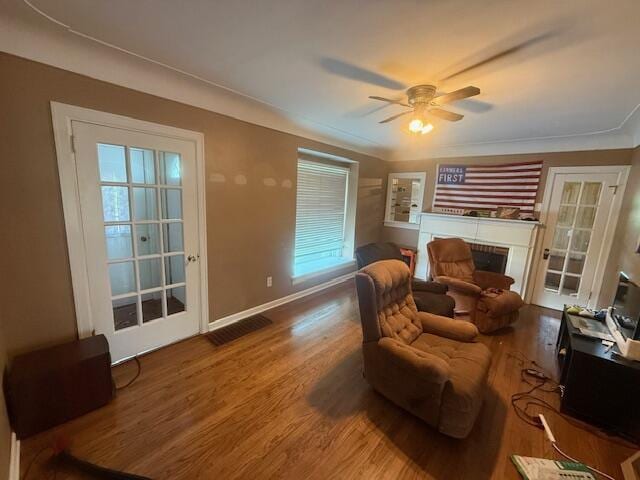 6185 Wing Ave SE, Grand Rapids, MI 49512 - living room featuring ceiling fan, wood finished floors, and a fireplace