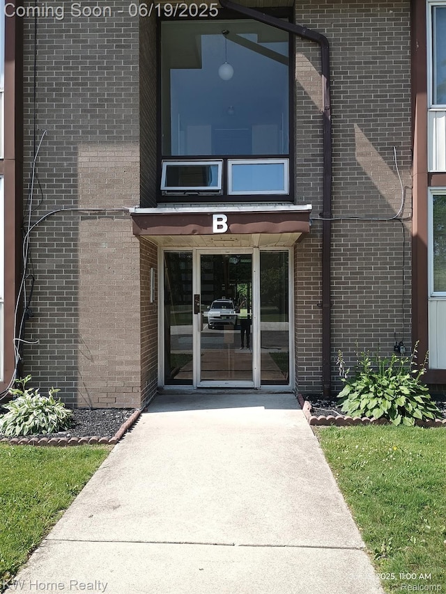 3901 Fort St Unit 204, Trenton, MI 48183 - property entrance with brick siding