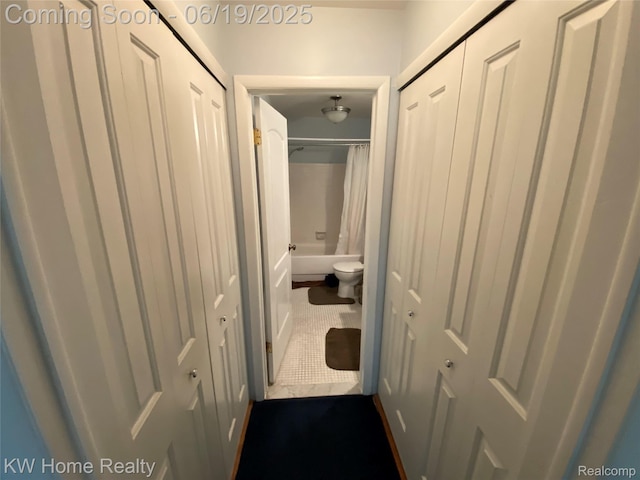 3901 Fort St Unit 204, Trenton, MI 48183 - corridor featuring dark tile patterned floors