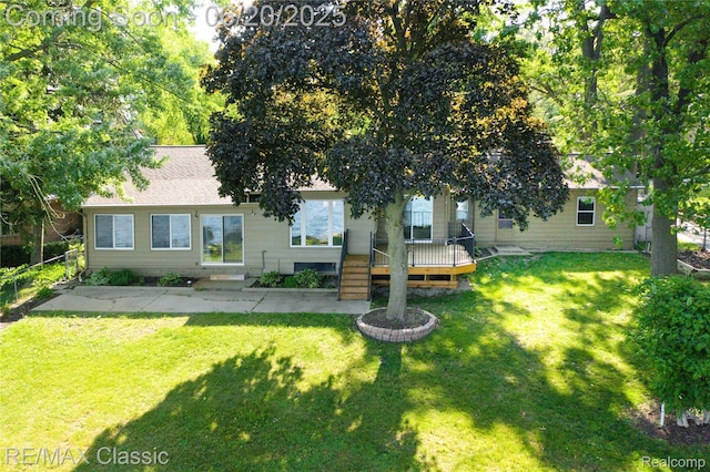 1861 Ladd Rd, Wolverine Lake, MI 48390 - back of property with a wooden deck and a patio