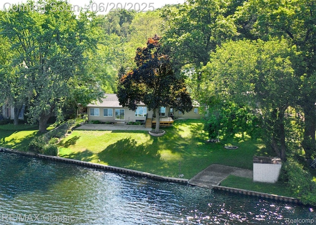 1861 Ladd Rd, Wolverine Lake, MI 48390 - view of subject property with a nearby body of water and a forest