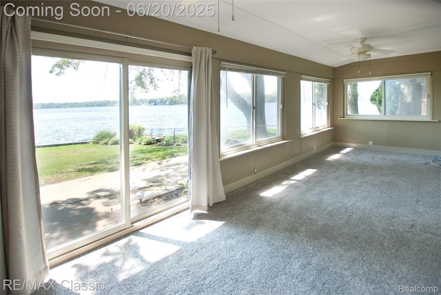 1861 Ladd Rd, Wolverine Lake, MI 48390 - unfurnished sunroom with carpet floors, a water view, and lofted ceiling