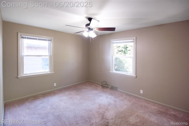 1861 Ladd Rd, Wolverine Lake, MI 48390 - spare room featuring carpet floors and a ceiling fan