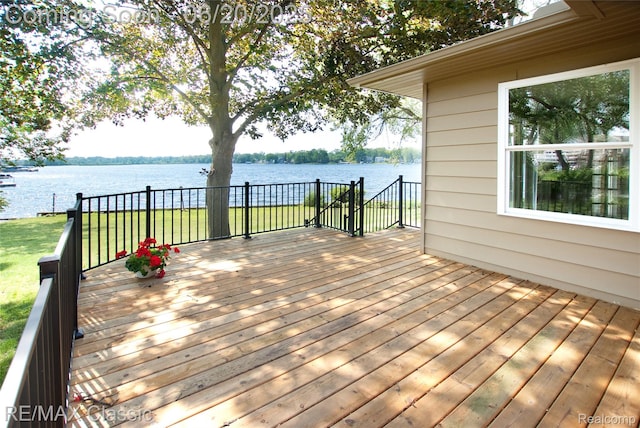 1861 Ladd Rd, Wolverine Lake, MI 48390 - wooden deck featuring a water view and a yard