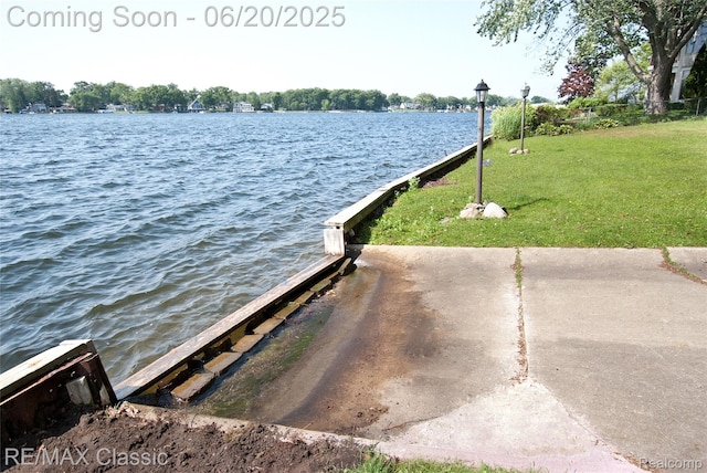 1861 Ladd Rd, Wolverine Lake, MI 48390 - dock area with a lawn and a water view