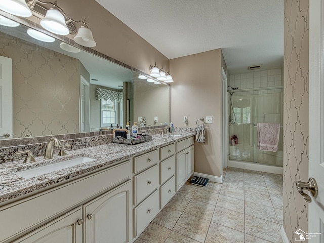831 Saint James Park Ave, Monroe, MI 48161 - full bath featuring double vanity, a shower stall, tile patterned flooring, and a textured ceiling