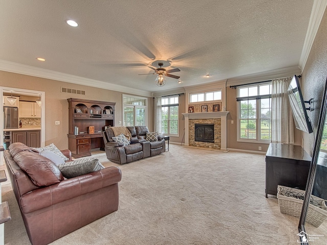 831 Saint James Park Ave, Monroe, MI 48161 - living room with crown molding, a textured ceiling, ceiling fan, a fireplace, and light carpet