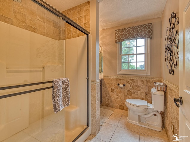 831 Saint James Park Ave, Monroe, MI 48161 - full bath featuring tile walls, a stall shower, a wainscoted wall, tile patterned floors, and a textured ceiling