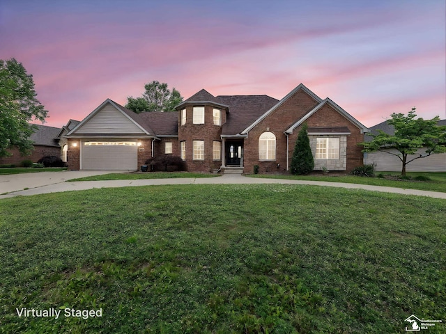 831 Saint James Park Ave, Monroe, MI 48161 - traditional-style house with brick siding, concrete driveway, an attached garage, and a front lawn
