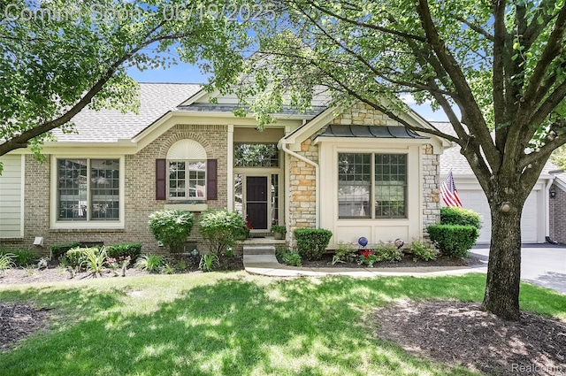 16822 Lochmoor Cir W, Northville, MI 48168 - view of front of property with a shingled roof, a front yard, brick siding, stone siding, and concrete driveway