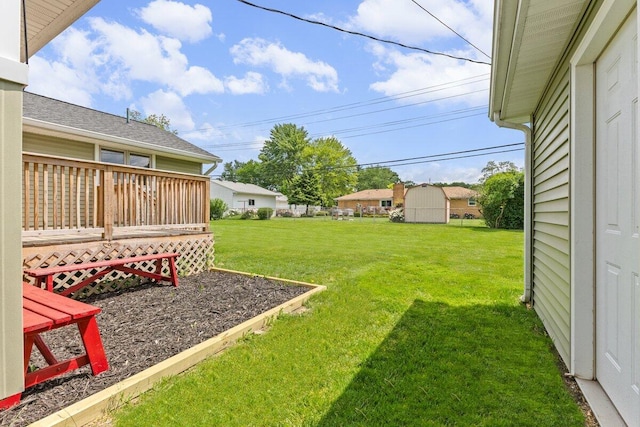 1228 Orchid St, Waterford, MI 48328 - view of grassy yard featuring a deck