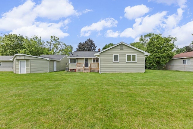 1228 Orchid St, Waterford, MI 48328 - back of property featuring a deck, a yard, an outdoor structure, and a chimney