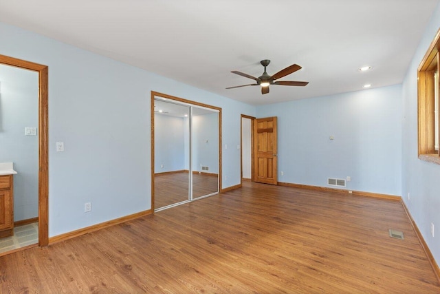 1228 Orchid St, Waterford, MI 48328 - unfurnished bedroom featuring light wood-type flooring, a closet, recessed lighting, and ceiling fan