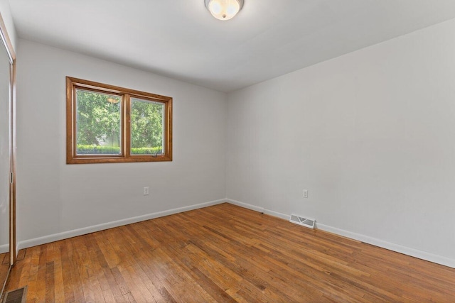 1228 Orchid St, Waterford, MI 48328 - empty room with hardwood / wood-style flooring and baseboards