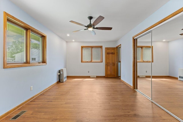 1228 Orchid St, Waterford, MI 48328 - unfurnished bedroom with light wood-type flooring, a closet, a ceiling fan, and recessed lighting