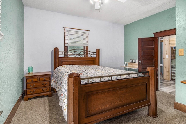 3833 S Baldwin Ave, Fremont, MI 49412 - bedroom with a textured wall, carpet floors, and a ceiling fan
