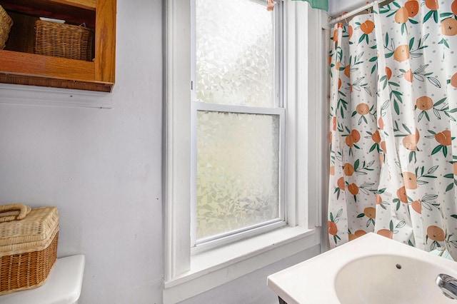 630 State St, Fremont, MI 49412 - bathroom with a shower with shower curtain